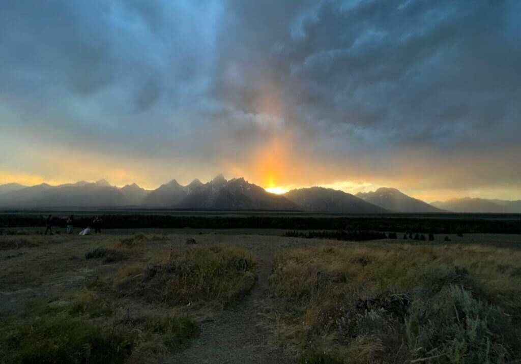 A sunset with the sun setting in the distance.