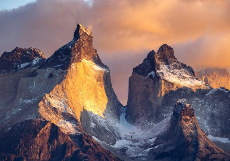 A mountain range with snow on it's sides.